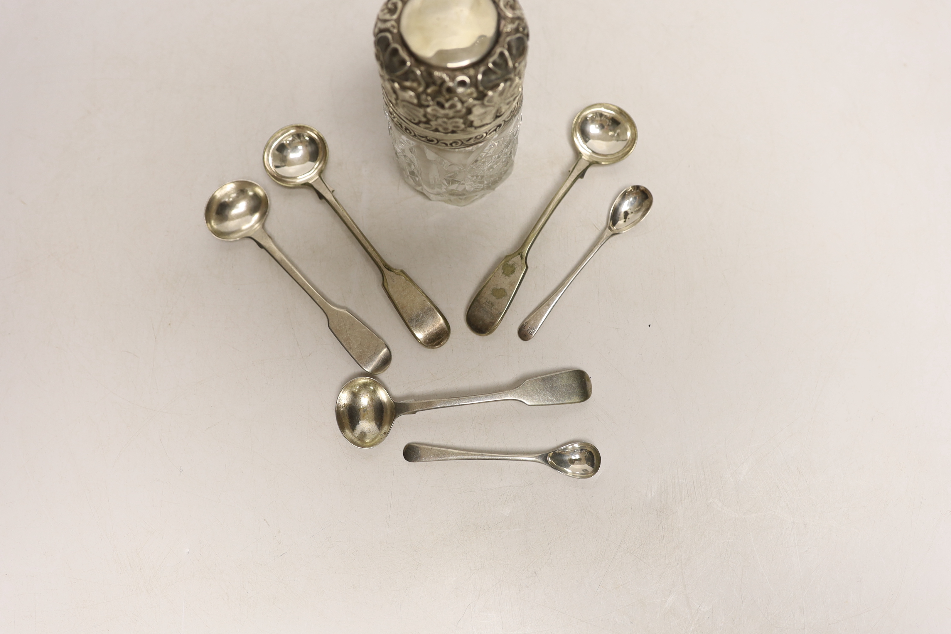 Four silver mustard ladles, including two 19th century, two plated ladles and an Edwardian silver mounted glass salts jar, London, 1905, 94mm.